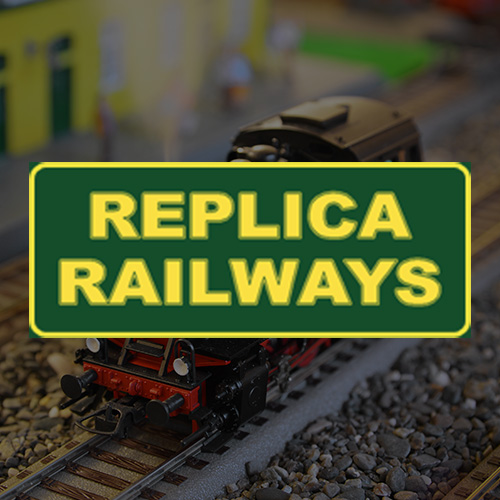 Replica Railways sign displayed above a model train setup showcasing intricate details and miniature railway tracks perfect for hobbyists and enthusiasts of model railways and trains. 6 unique models can be created for varied layouts.
